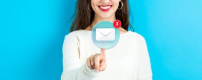 women clicking on inbox with 3 new emails