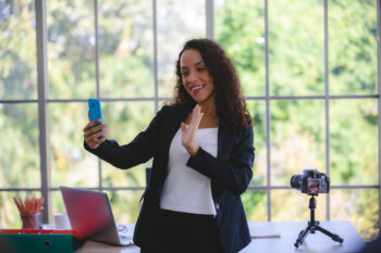 business woman doing a live story on social media platform