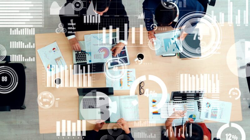 Creative visual of business people in corporate staff meeting How to Use AI for Business