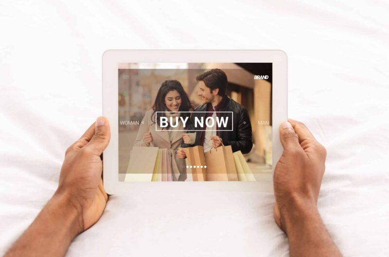 Black man holding tablet computer with online shop website on screen, closeup. Collage The Essentials of Google Display Ads