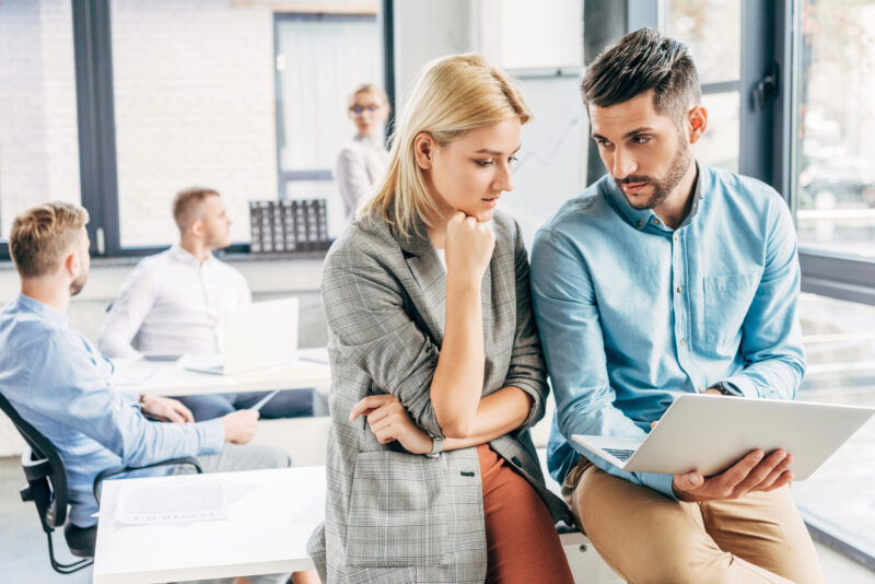 coworkers discussing AI business strategy