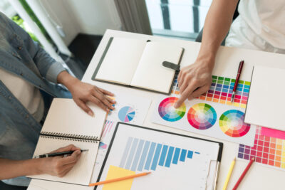 graphic designer choosing color palette for brand and website design