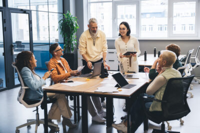 Marketing team discussing generative AI and LLM efforts for their business