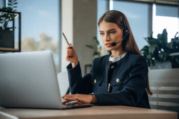 young sales woman using AI to make calls